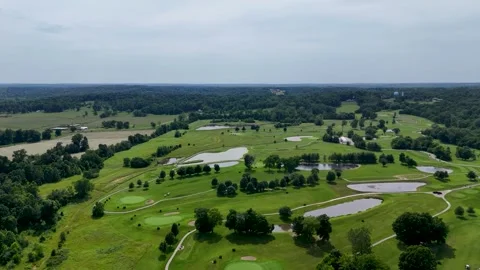 Drone Flight Over Lush Green Golf Course and Scenic Countryside Stock Footage 337637873