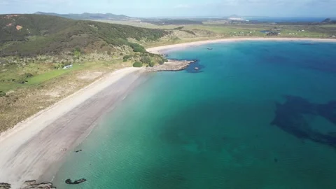 Drone flight over Maitai Bay in New Zealand Stock Footage 246986049