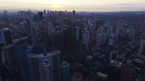 Drone Flight Over Makati Skyline At Sunrise Symbolizing Global South Growth Stock Footage 328153174