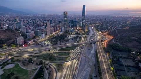 Drone flight over Mapocho River and skyline facing Costanera Center Stock Footage 311006997
