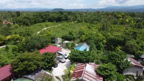 Drone flight over Moalboal White Beach coastline with tropical sea jungle an Stock Footage 335395131