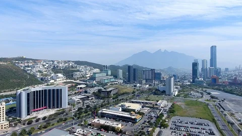DRONE FLIGHT OVER MONTERREY WITH CERRO DE LA SILLA BEHIND Stock Footage 107289575