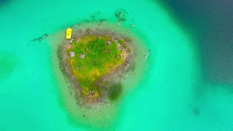 Drone flight over mountain lake Eibsee beneath Zugspitze peak. Stock Footage 84834334