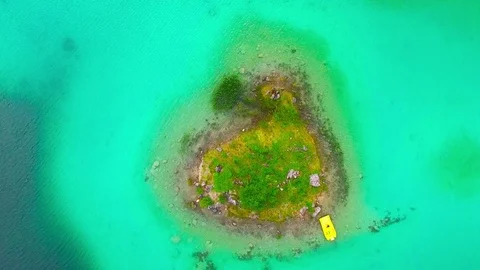 Drone flight over mountain lake Eibsee beneath Zugspitze peak. Stock Footage 84834900