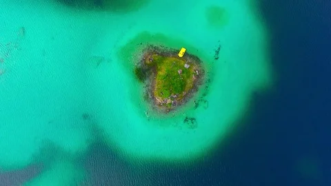 Drone flight over mountain lake Eibsee beneath Zugspitze peak. Video stock 84836645