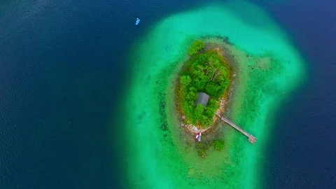Drone flight over mountain lake Eibsee beneath Zugspitze peak. Video stock 84837206