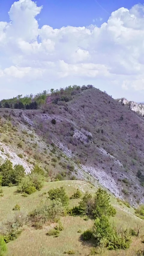Drone flight over mountain ridge, clouds, vertical footage, social media nature Stock Footage 283343219