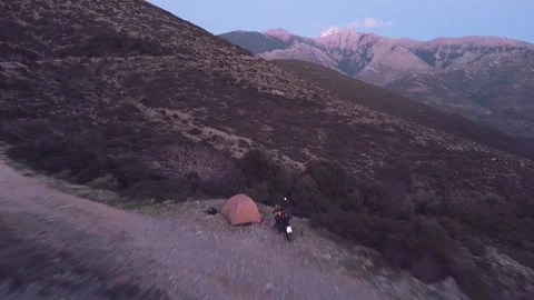 Drone Flight Over Mountain Road, Tent and Motorcycle in Greece Stock Footage 337770467