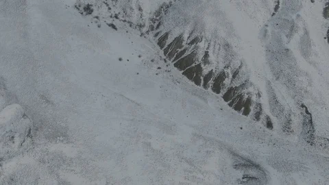 Drone flight over the mountain slopes in the snow Stock-Footage 104910805