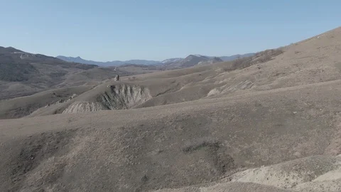 Drone flight over the mountain slopes with a family resting Stock Footage 106200232