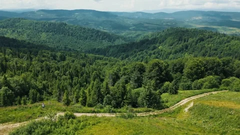 Drone flight over mountainous terrain, beautiful landscape. A mountain path that Stock Footage 282914961