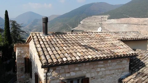 Drone flight over old rooftops  and a river behind Stock Footage 113200633