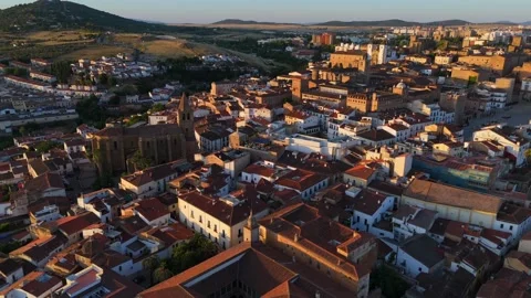 Drone flight over old stone churches palaces and tiled roofs of Caceres Spain Stock-Footage 342320779