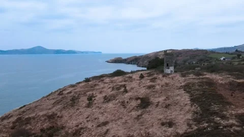 Drone flight over old tower and ocean in Ireland Stock Footage 267079269