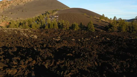 Drone flight over one of oldest volcanic lava mountains on earth. Cinder Stock Footage 165450125