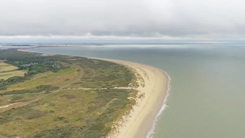 Drone flight over Ouddorp lighthouse and coastal dunes, Netherlands Stock Footage 315864336