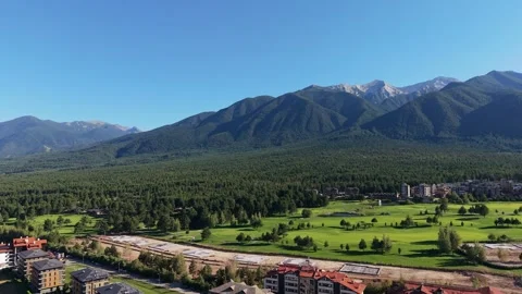Drone flight over pine forests and golf course in Pirin, Bulgaria Stock Footage 343792866