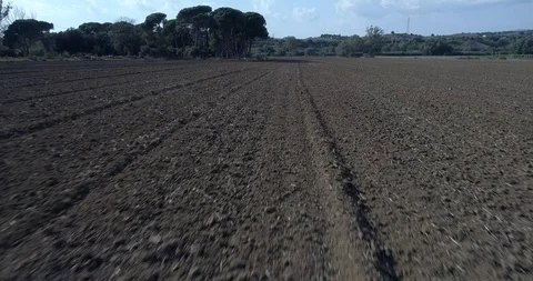 Drone flight over plowed field Stock Footage 95900255