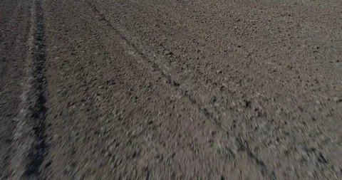 Drone flight over plowed field Stock-Footage 95900362