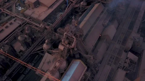 Drone flight over the production site of steel works and smoke stacks Stock Footage 96252930