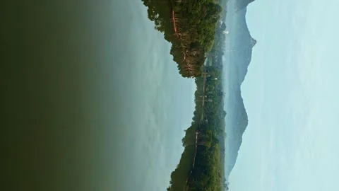 Drone Flight Over Reflective River Capturing Cloudy Sky and Tropical Forest Stock Footage 279791935