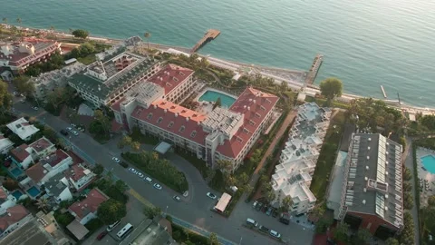 Drone flight over the resort town of Turkey. Sea, dawn, hotels 4 K Video stock 217910095