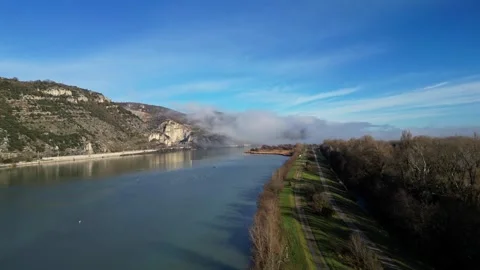 Drone Flight Over the Rhone River in Southern France, with Dense Morning Fog Stock Footage 300837229