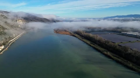 Drone Flight Over the Rhone River in Southern France, with Dense Morning Fog Stock Footage 300887447