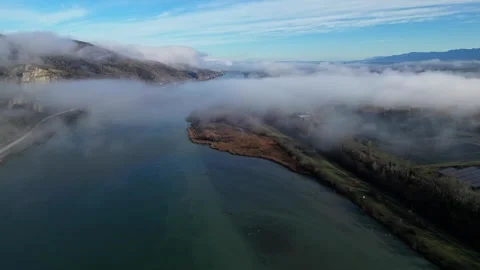 Drone Flight Over the Rhone River in Southern France, with Dense Morning Fog Stock Footage 300888894