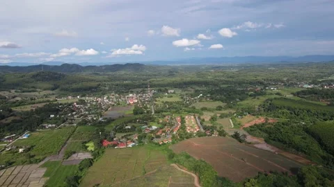 Drone flight over rice fields in Chiang Rai Province of Northern Thailand. Stock Footage 135707295