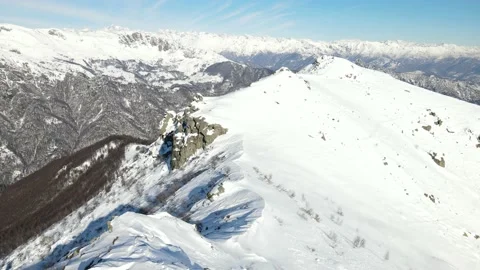 Drone flight over the ridge of the mountain with snow in winter. alps 4k Stock Footage 147858878