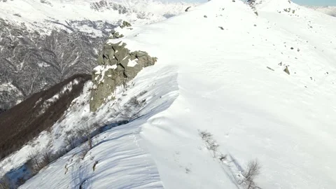 Drone flight over the ridge of the mountain with snow in winter. alps 4k Stock Footage 147858939