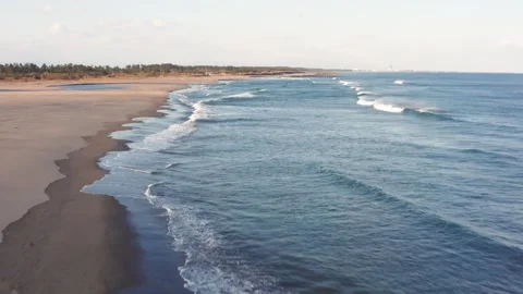 Drone flight over river and beach with waterbirds at sunset Miyazaki Japan Stock Footage 259670509