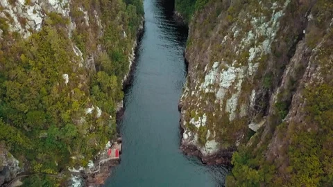Drone Flight Over River Between Rocky Mountains Stock Footage 314694254