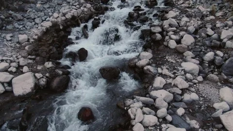 Drone flight over the river flowing from the slopes of Elbrus. 動画素材 147638561