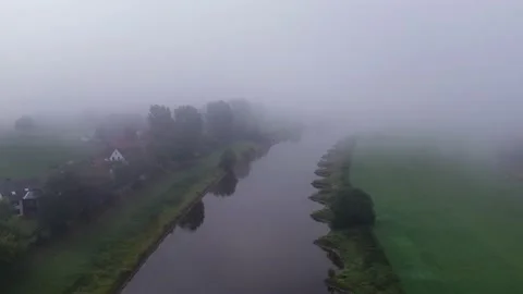Drone flight over river in fog, Germany Stockbeeldmateriaal 141112622