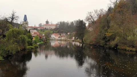 Drone flight over the river in a small historical czech town in autumn time Stock Footage 145050576