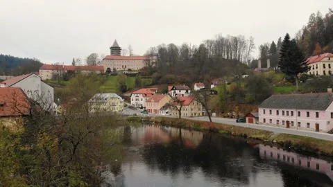 Drone flight over the river in a small historical czech town in autumn time Stock Footage 145050580