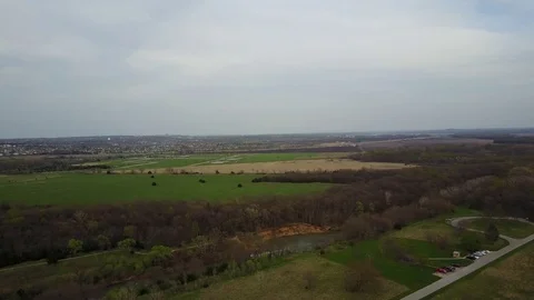 Drone Flight Over River, Trees and Farms, Towards Town Stock Footage 85424902