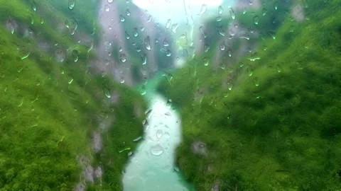 Drone flight over the river, wet glass effect Stock Footage 154354089