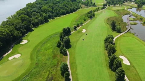 Drone Flight Over Riverfront Golf Course with Carts Stock Footage 346188715