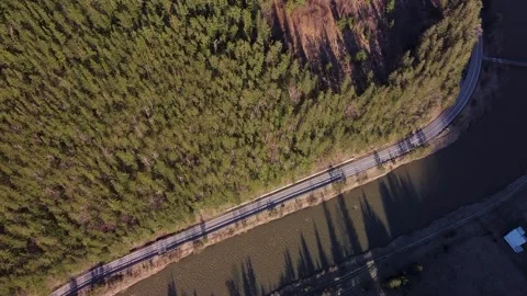 Drone Flight over Road Beside the River Through the Forest Stock-Footage 270433356