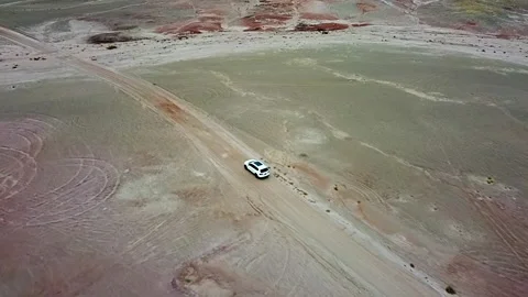 Drone flight over Road at Utah National Park with car on calm mountain road Stock Footage 205066361