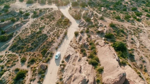Drone flight over Road at Utah Zion National Park with vintage wedding car Stock Footage 214065632