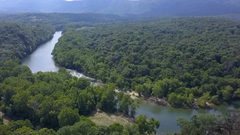 Drone flight over the roaring, summer-time, Shenandoah River. Video stock 94033134