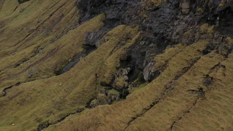 Drone Flight Over Rock Mountain Slopes Of Faroe Islands Video stock 134283548