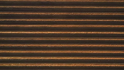 Drone flight over rows of soil before planting Stock Footage 157584533