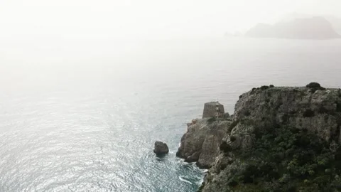 Drone flight over the rugged cliffs of the Sorrento Coast Stock Footage 304668609
