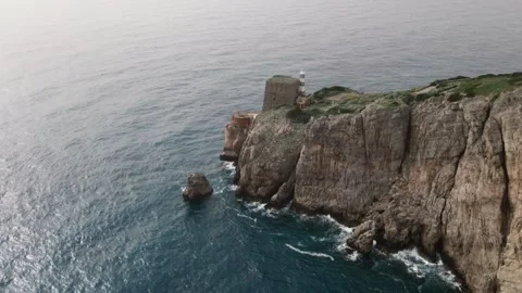 Drone flight over the rugged cliffs of the Sorrento Coast, Punta Campanella Stock Footage 304668623