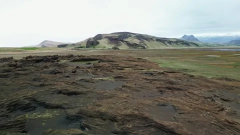 Drone flight over rugged lava field and moss in Iceland 4K Stock Footage 343869589